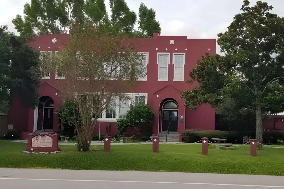 Historic red Simonton School building in Simonton, Texas