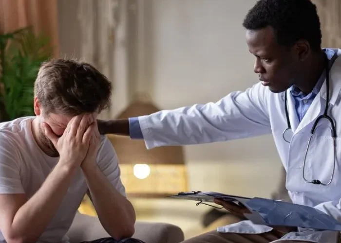 Psychiatrist offering reassurance to a patient during a mood disorder treatment visit in Katy, Texas