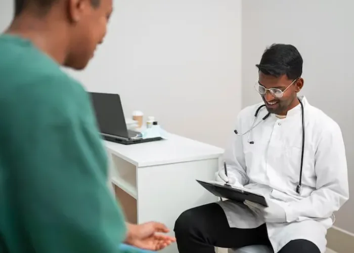 Psychiatrist reviewing notes with a patient during an OCD treatment consultation in Katy, Texas