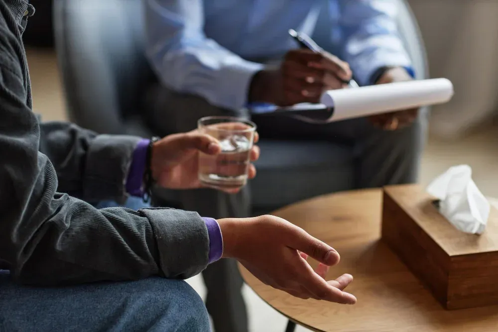 Client sharing feelings with a counselor during an individual therapy session